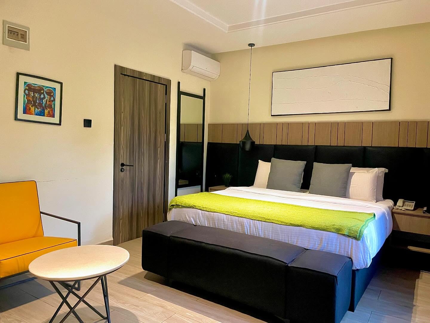 Seven Lugard guest room with a bed and seating area